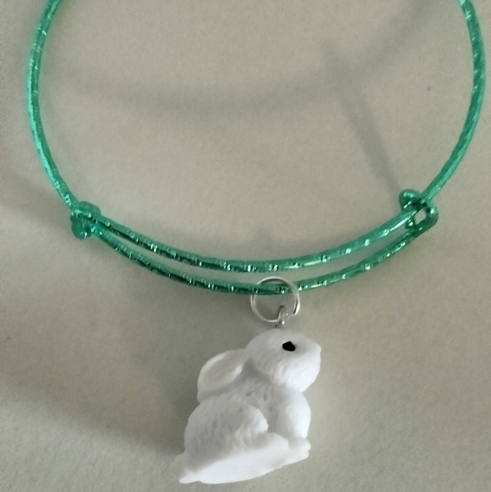 White bunny on green bracelet